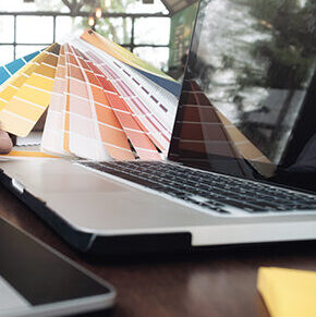 Graphic design and color swatches and pens on a desk. Architectu